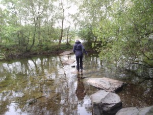 Tiptoeing across a river in Snowdonia